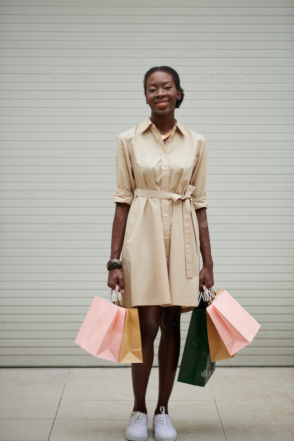 Black Woman Holding Many Paper-Bags - Stock Photo - Images