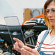 Female mechanic with security glasses holding transparent tablet - PhotoDune Item for Sale