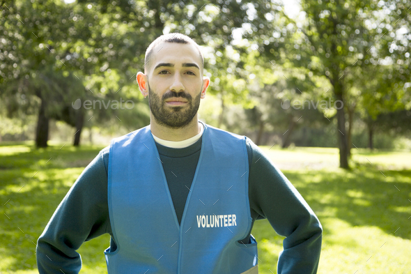 Committed young man volunteering for the environment. - Stock Photo - Images