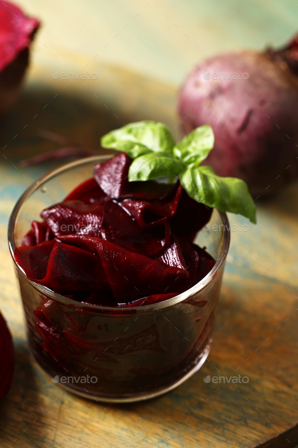 pickled beets in a jar on a wooden table - Stock Photo - Images