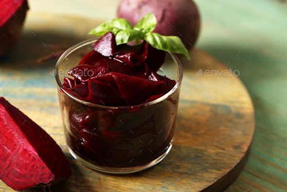 pickled beets in a jar on a wooden table - Stock Photo - Images