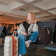 Travel.young woman at airport at window with suitcase waiting for plane, girl waiting for departure  - PhotoDune Item for Sale