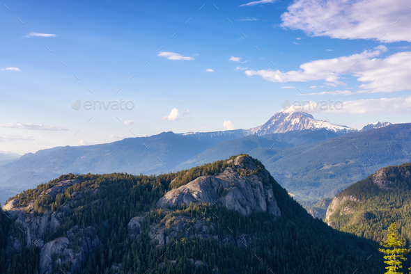 Rocky Mountain Cliffs and green trees in Canadian Nature Landscape. - Stock Photo - Images