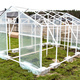 Assembling a home greenhouse from an aluminum frame and thick foil. - PhotoDune Item for Sale