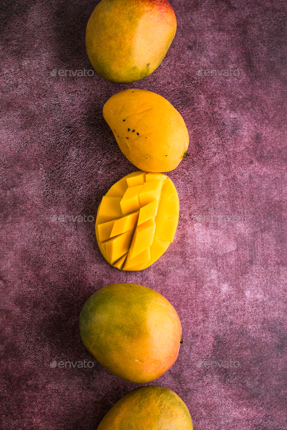 Mango background design concept. Top view of diced fresh mango fruit ...