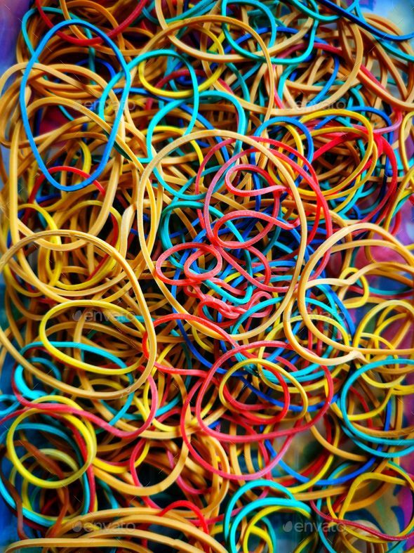 Vertical shot of colorful rubber bands Stock Photo by wirestock