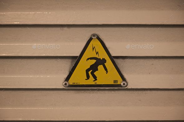 Closeup of the sign of a man getting hit with electricity, the cover of \
