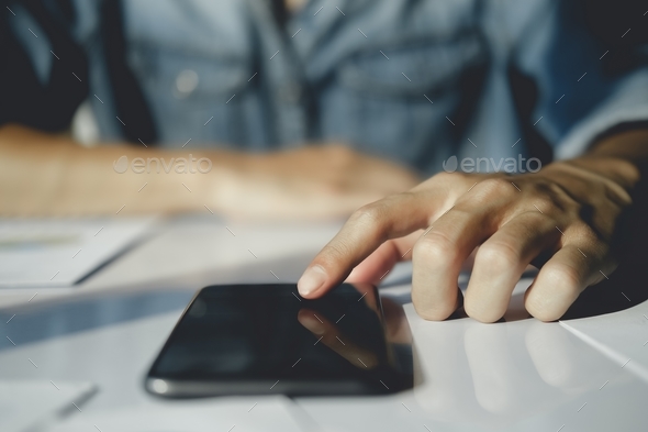 Close-up image of male hands using smartphone. - Stock Photo - Images