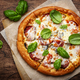 Pizza with spicy salami sausage, mozzarella cheese, tomato sauce and green basil - PhotoDune Item for Sale