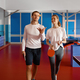 Two table tennis player walking and talking after training at sport club - PhotoDune Item for Sale