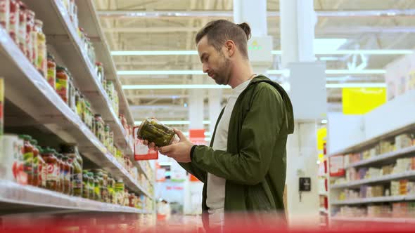 He Wants to Buy Pickled Cucumbers in the Grocery alt