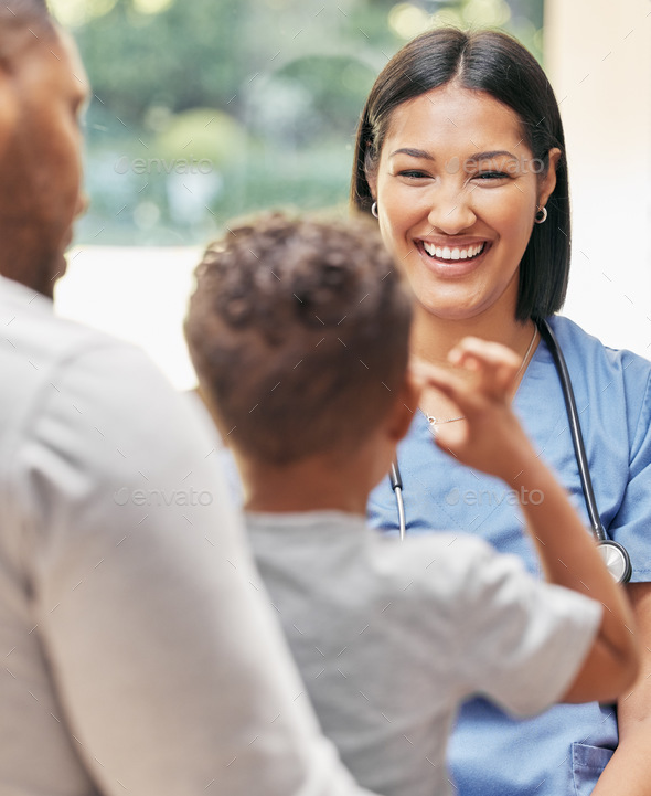 Caring female nurse working with a family. Friendly nurse talking to ...