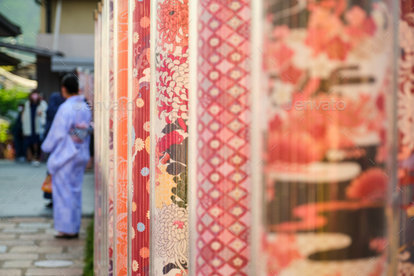 Kimono forest with poles decorated with Japanese fabrics at Arashiyama Station. - Stock Photo - Images