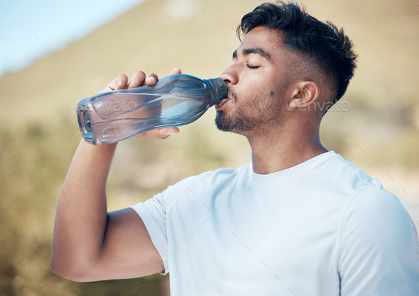 Man drinking water from a big bottle Stock Photo