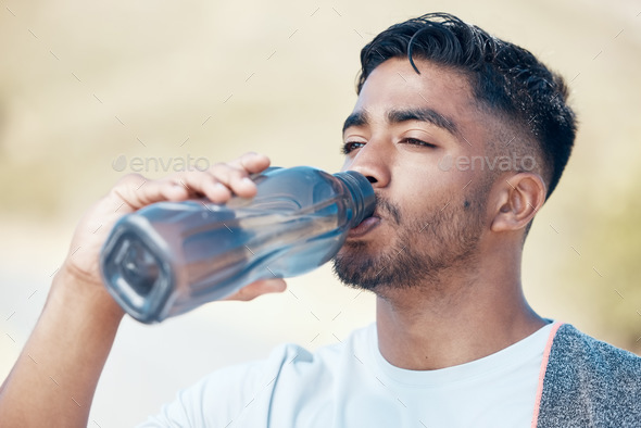 Man drinking water from a big bottle Stock Photo