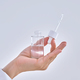 Female hands hold a cosmetic serum with a dropper. - PhotoDune Item for Sale