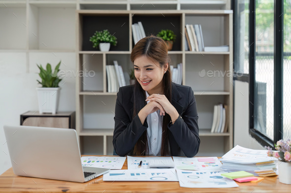 Business woman, portrait and smile at desk in office for paperwork, laptop. Happy young or - Stock Photo - Images