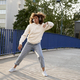 Wide shot of black woman wearing headphones and dancing on the bridge - PhotoDune Item for Sale