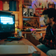 Guy playing video console in garage - PhotoDune Item for Sale