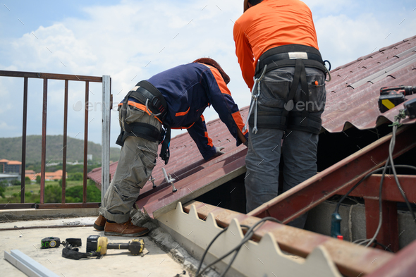 Professional engineer worker installing solar panels system on rooftop