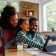 Happy black family using digital tablet together at home. - PhotoDune Item for Sale