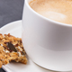 Cup of coffee with milk and fresh baked oatmeal cookies with honey and healthy seeds - PhotoDune Item for Sale