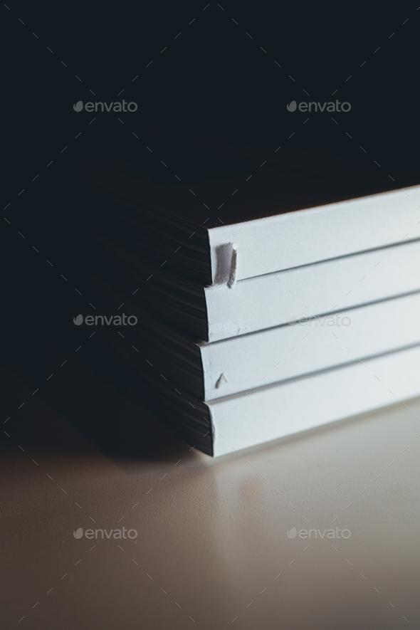 Vertical closeup of the antique books on the bookshelf. Stock Photo by  wirestock