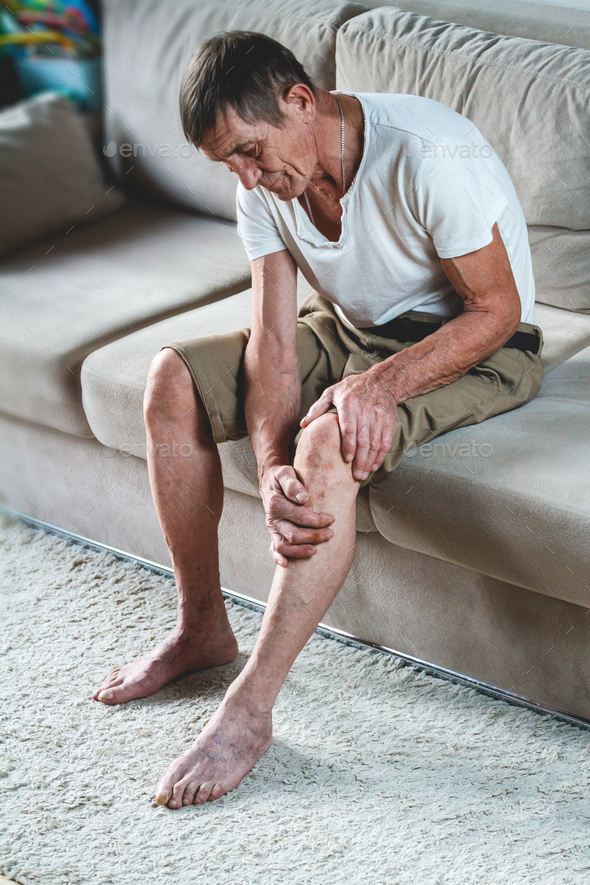 Pain in the legs and knees of an elderly senior
