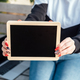 Young student girl holding black chalkboards with blank copy space screen for your advertising text - PhotoDune Item for Sale