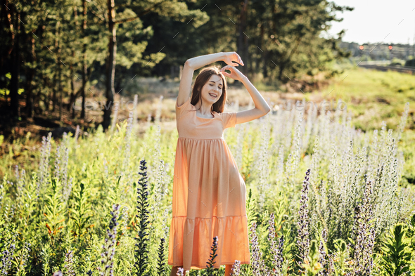 Enjoy a healthy, fun and happy summer. Outdoor portrait of happy smiling young woman in nature - Stock Photo - Images