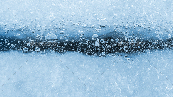 Ice with frozen air bubbles, close-up natural texture - Stock Photo - Images