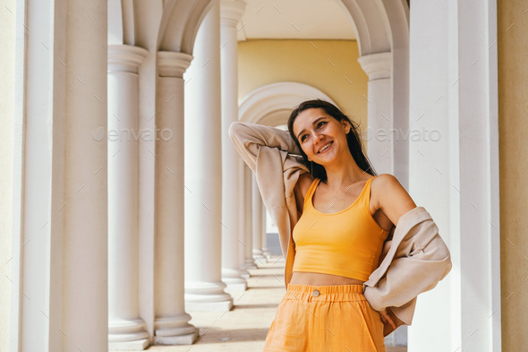 Emotional portrait of caucasian brunette woman in casual clothes. Travel concept. - Stock Photo - Images