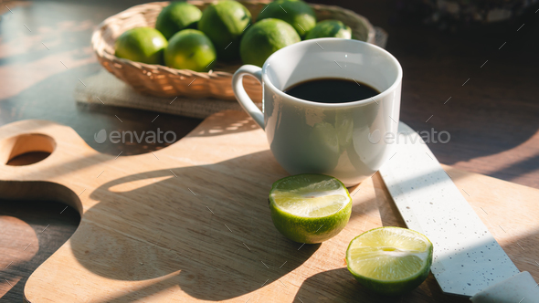 A cup of coffee with lemon no sugar, concept of healthy drink and detox colon or diet food. - Stock Photo - Images