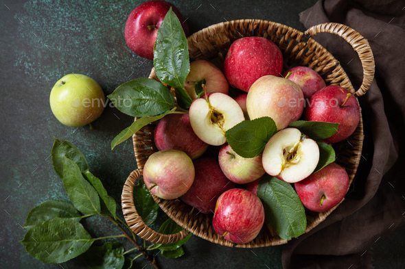 Basket of ripe apples on a stone table. View from above. - Stock Photo - Images