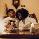 African american couple having romantic date at home and taking selfie with a smartphone - PhotoDune Item for Sale