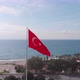 Turkish flag featuring white star waving in wind against blue sky. National flag of Turkey - VideoHive Item for Sale