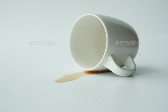 cup of coffee spilled on white background  - Stock Photo - Images