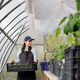 woman with box of seedlings in greenhouse transplants of vegetables and fruits, tomatoes - PhotoDune Item for Sale