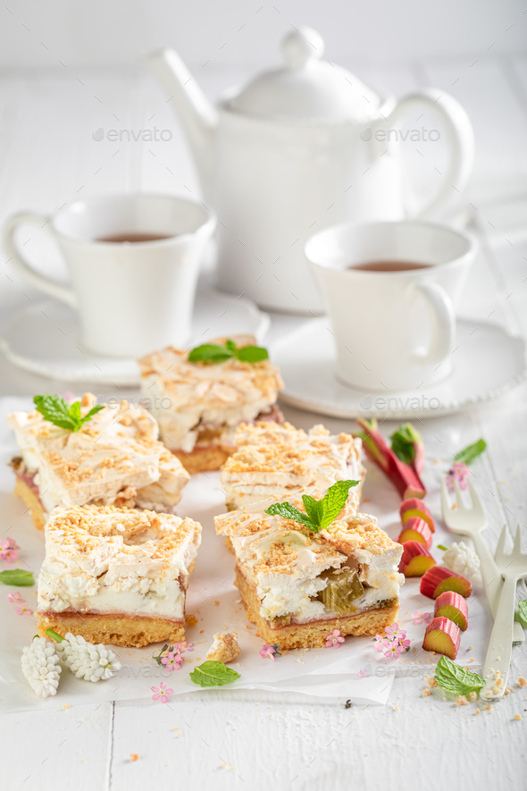 Delicious rhubarb yeast cake with foam and crumble. - Stock Photo - Images