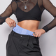 Cropped shot of unknown faceless woman with slim figure wears black top and trousers shows flat - PhotoDune Item for Sale