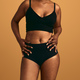 Crop black obese woman in underwear standing against beige background - PhotoDune Item for Sale