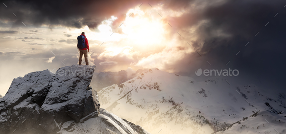 Adventurous Man Standing on top of Mountain Cliff. Exteme Adventure Composite - Stock Photo - Images