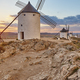 Traditional antique windmills at sunset in Spain. Consuegra, Toledo - PhotoDune Item for Sale