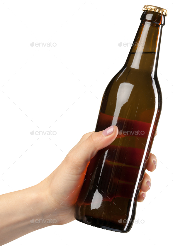 brown beer bottle in hand isolated on white background Stock Photo by