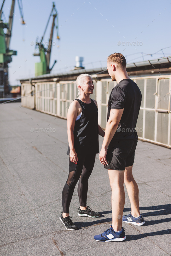 Couple happy after workout in ubran industrial city area - Stock Photo - Images