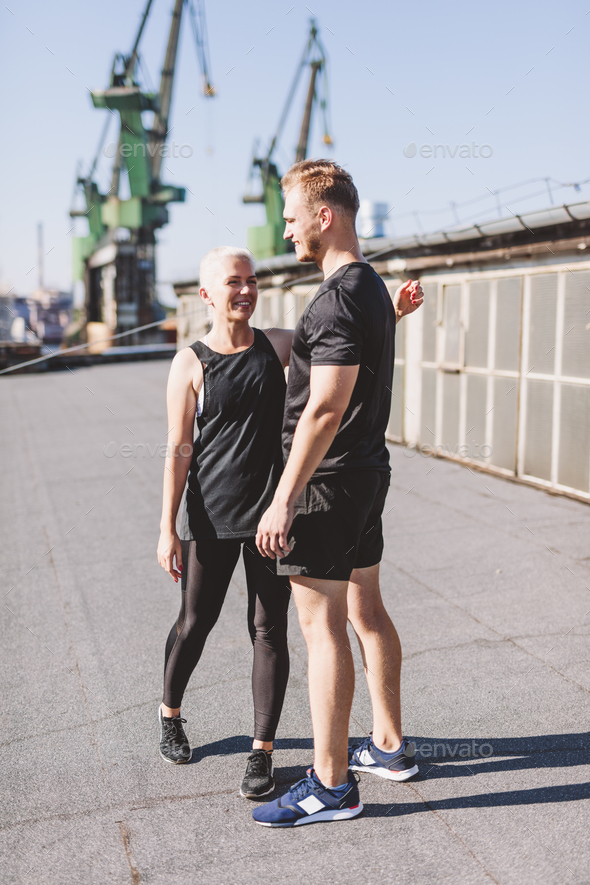 Couple happy after workout in ubran industrial city area - Stock Photo - Images