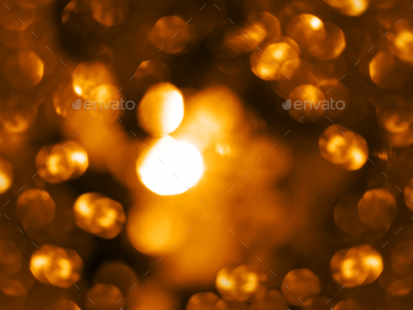 Golden warm sparkling defocused light overlay Orange yellow bokeh backdrop Christmas New Year