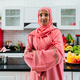 Happy and beautiful  middle eastern woman wearing traditional arab clothing at home - PhotoDune Item for Sale