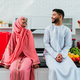 Happy middle eastern couple wearing traditional arab clothing at home - PhotoDune Item for Sale
