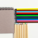colored pencils and notepad on the table - PhotoDune Item for Sale